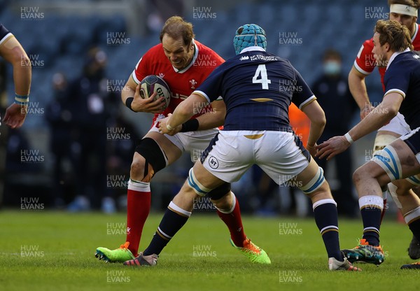 130221 - Scotland v Wales - Guinness 6 Nations - Alun Wyn Jones of Wales is tackled by Scott Cummings of Scotland