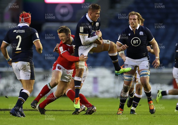 130221 - Scotland v Wales - Guinness 6 Nations - Matt Fagerson of Scotland is tackled by Dan Biggar of Wales