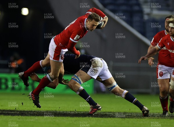 130221 - Scotland v Wales - Guinness 6 Nations - Dan Biggar of Wales is tackled by Scott Cummings of Scotland