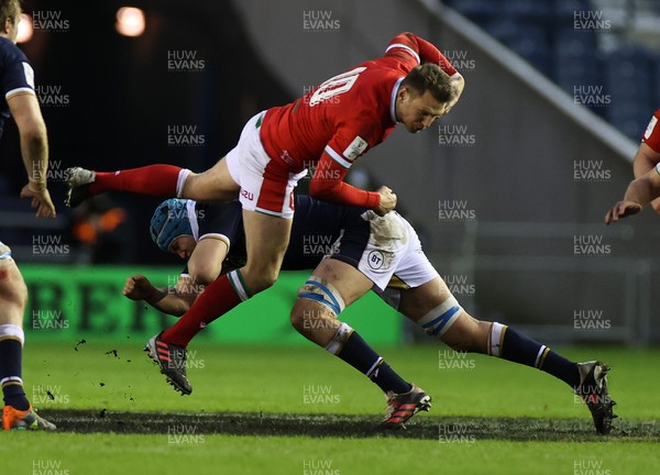 130221 - Scotland v Wales - Guinness 6 Nations - Dan Biggar of Wales is tackled by Scott Cummings of Scotland