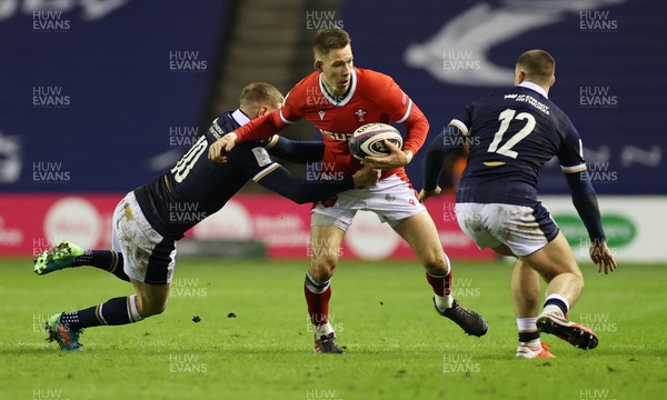 130221 - Scotland v Wales - Guinness 6 Nations - Liam Williams of Wales is tackled by Finn Russell of Scotland