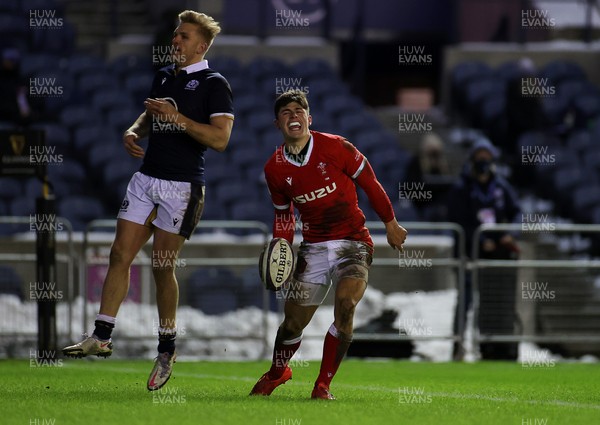 130221 - Scotland v Wales - Guinness 6 Nations - Louis Rees-Zammit of Wales celebrates scoring a try