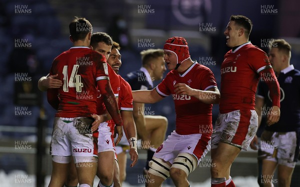 130221 - Scotland v Wales - Guinness 6 Nations - Louis Rees-Zammit of Wales celebrates scoring a try with team mates