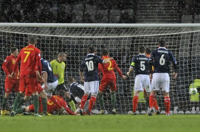 220313 -  Scotland v Wales - 2014 FIFA World Cup Qualifier -  Hampden Park - Scotland - Grant Hanley of Scotland (4) scores  