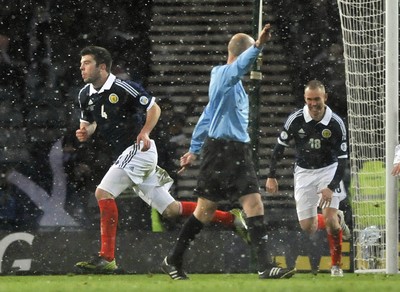 220313 -  Scotland v Wales - 2014 FIFA World Cup Qualifier -  Hampden Park - Scotland - Grant Hanley of Scotland celebrates scoring 
