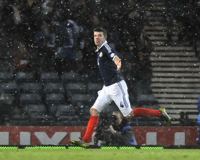 220313 -  Scotland v Wales - 2014 FIFA World Cup Qualifier -  Hampden Park - Scotland - Grant Hanley of Scotland celebrates scoring 