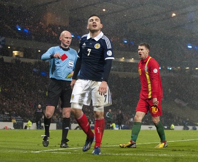 220313 -  Scotland v Wales - 2014 FIFA World Cup Qualifier -  Hampden Park - Scotland - Robert Snodgrass of Scotland is sent off by the referee 