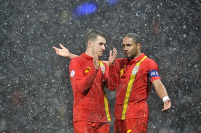 220313 -  Scotland v Wales - 2014 FIFA World Cup Qualifier -  Hampden Park - Scotland - Aaron Ramsey of Wales and Ashley Williams of Wales at the end of the match 