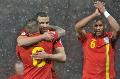 220313 -  Scotland v Wales - 2014 FIFA World Cup Qualifier -  Hampden Park - Scotland - Hal Robson-Kanu of Wales celebrates with Craig Bellamy of Wales 