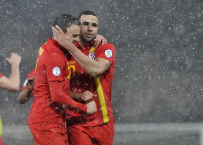220313 -  Scotland v Wales - 2014 FIFA World Cup Qualifier -  Hampden Park - Scotland - Chris Gunter of Wales and Hal Robson-Kanu of Wales celebrate at the end of the match 