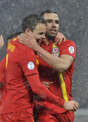 220313 -  Scotland v Wales - 2014 FIFA World Cup Qualifier -  Hampden Park - Scotland - Chris Gunter of Wales, left, and Hal Robson-Kanu of Wales celebrates at the final whistle 