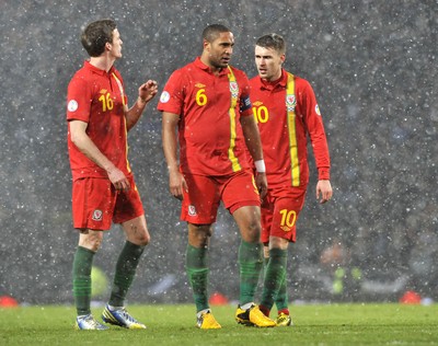 220313 -  Scotland v Wales - 2014 FIFA World Cup Qualifier -  Hampden Park - Scotland - Andy King, left, Ashley Williams and Aaron Ramsey of Wales 