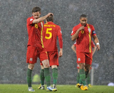 220313 -  Scotland v Wales - 2014 FIFA World Cup Qualifier -  Hampden Park - Scotland - Reaction from Andy King, left,  and Ashley Williams of Wales 