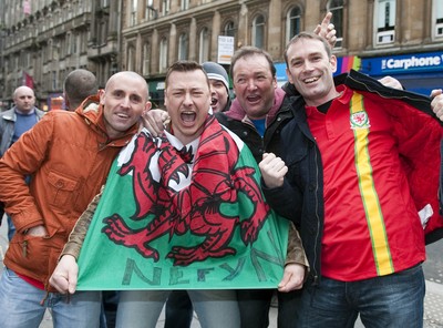 220313 -  Scotland v Wales - 2014 FIFA World Cup Qualifier -  Hampden Park - Scotland - Wales fans pictured in Glasgow city centre 