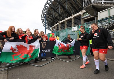 220325  Scotland v Wales, Guinness Women’s Six Nations 2025 - Wales Captain Hannah Jones and Carys Phillips of Wales make their way to the pitch past Wales fans