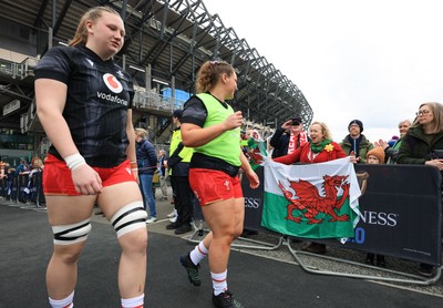 220325  Scotland v Wales, Guinness Women’s Six Nations 2025 - Alaw Pyrs of Wales and Gwenllian Pyrs of Wales make their way to the pitch past Wales fans