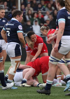 220325  Scotland v Wales, Guinness Women’s Six Nations 2025 - Kayleigh Powell of Wales and Keira Bevan of Wales congratulate Carys Phillips of Wales after she scores try