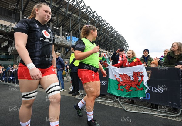 220325  Scotland v Wales, Guinness Women’s Six Nations 2025 - Alaw Pyrs of Wales and Gwenllian Pyrs of Wales make their way to the pitch past Wales fans