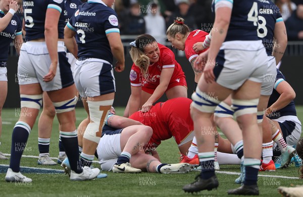 220325  Scotland v Wales, Guinness Women’s Six Nations 2025 - Kayleigh Powell of Wales and Keira Bevan of Wales congratulate Carys Phillips of Wales after she scores try