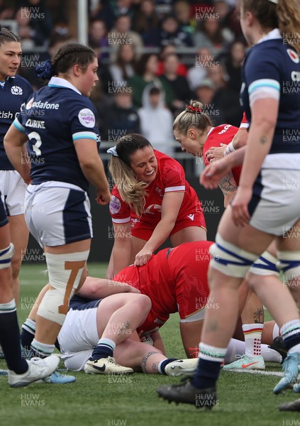 220325  Scotland v Wales, Guinness Women’s Six Nations 2025 - Kayleigh Powell of Wales and Keira Bevan of Wales congratulate Carys Phillips of Wales after she scores try