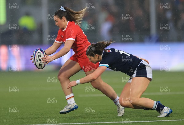 220325  Scotland v Wales, Guinness Women’s Six Nations 2025 - Kayleigh Powell of Wales is tackled by Francesca McGhie of Scotland