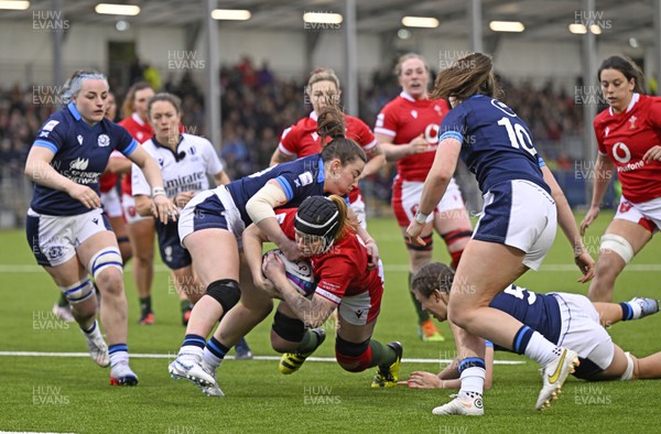 010423 - Scotland v Wales - TikTok Women's Six Nations - Eilidh Sinclair of Scotland tackles Bethan Lewis of Wales