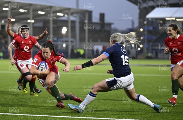 010423 - Scotland v Wales - TikTok Women's Six Nations - Ffion Lewis of Wales scores the last try of the game to secure victory for Wales despite Chloe Rollie of Scotland
