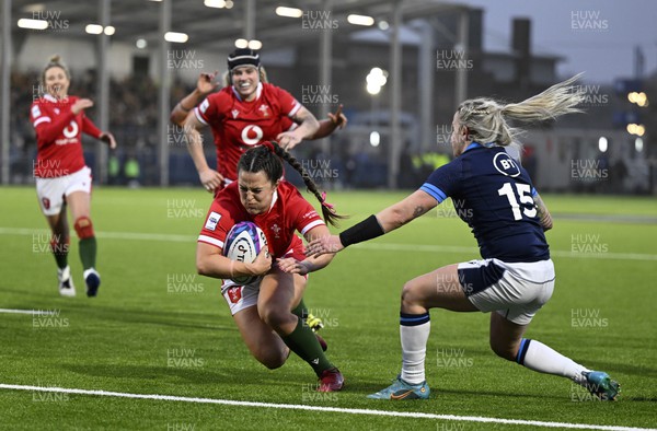 010423 - Scotland v Wales - TikTok Women's Six Nations - Ffion Lewis of Wales scores the last try of the game to secure victory for Wales despite Chloe Rollie of Scotland