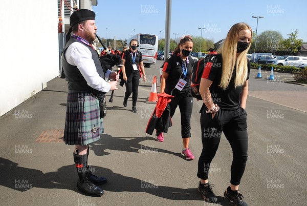240421 - Scotland Women v Wales Women - Women's Six Nations - Wales Women team arrive at Scotstoun Stadium to a traditional welcome from a lone piper