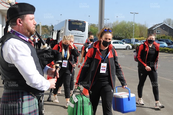 240421 - Scotland Women v Wales Women - Women's Six Nations - Wales Women team arrive at Scotstoun Stadium to a traditional welcome from a lone piper