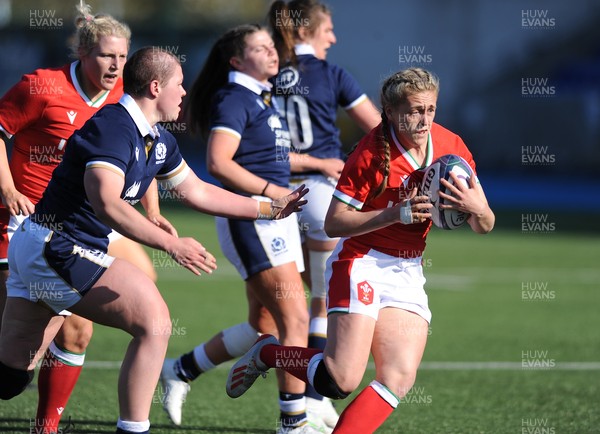 240421 - Scotland Women v Wales Women - Women's Six Nations - Hannah Jones of Wales escapes the clutches of Scotland prop Megan Kennedy
