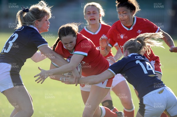 240421 - Scotland Women v Wales Women - Women's Six Nations - Caitlan Lewis of Wales drives into Hannah Smith of Scotland and Liz Musgrove