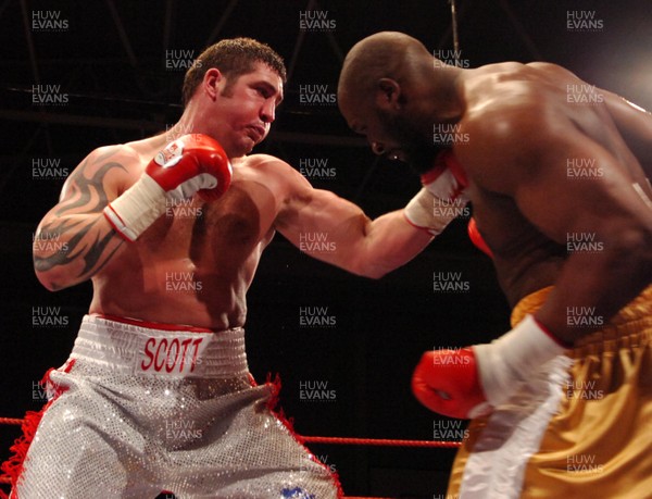 020307 - Boxing British Heavyweight Title -  Scott Gammer (silver shorts) and Danny Williams (Gold shorts) trade blows  