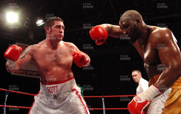 020307 - Boxing British Heavyweight Title -  Scott Gammer (silver shorts) and Danny Williams (Gold shorts) trade blows  