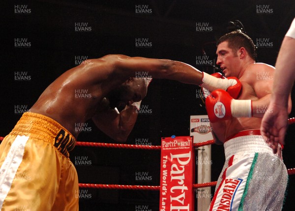 020307 - Boxing British Heavyweight Title -  Scott Gammer (silver shorts) and Danny Williams (Gold shorts) trade blows  