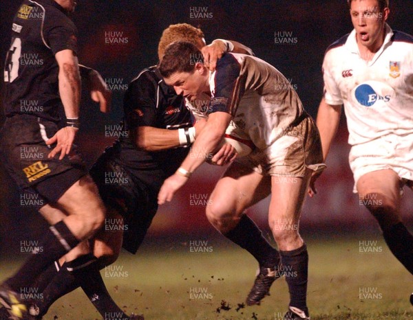 27-12-02. Swansea v Neath Dave Tiueti (Neath) gets hold of Scott Gibbs. 