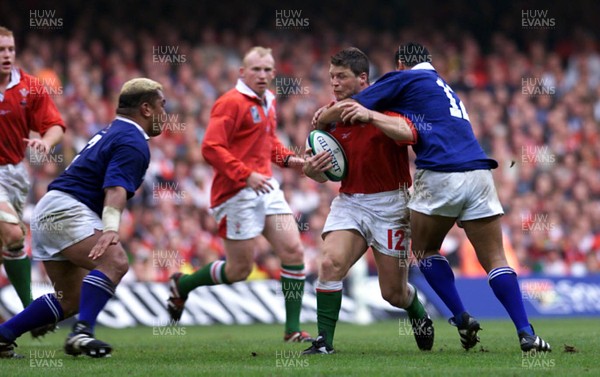 Library pic Wales v Samoa...Rugby World Cup,Cardiff. Scott Gibbs is tackled by  George Leaupepe.  