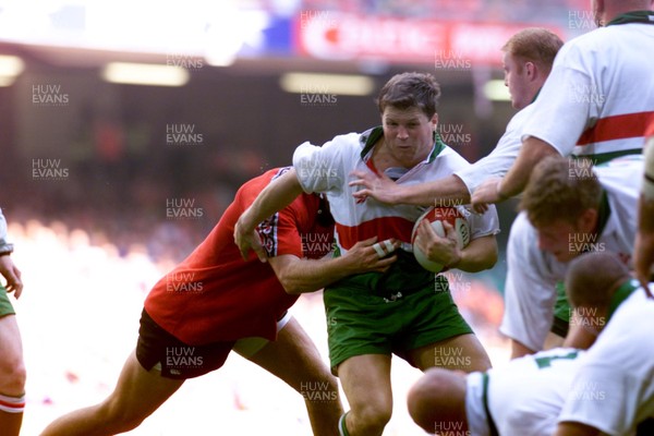 21.08.99 Wales v Canada.Pic Huw Evans Wales Scott Gibbs is tackled by John Tait