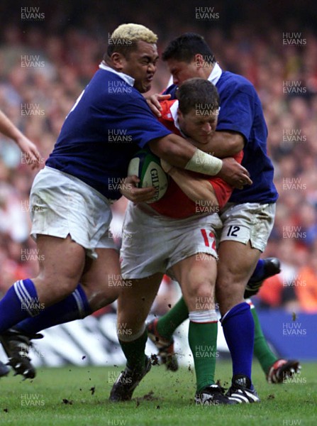 Library pic Wales v Samoa...Rugby World Cup,Cardiff. Scott Gibbs is tackled by George Leaupepe(rt) and Trevor Leota. 