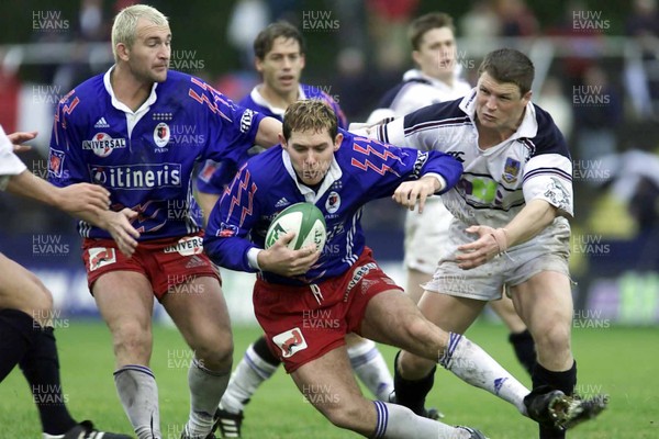 14.10.00...Swansea v Stade Francais  Stade Francais Simon Mason is caught by Scott Gibbs  