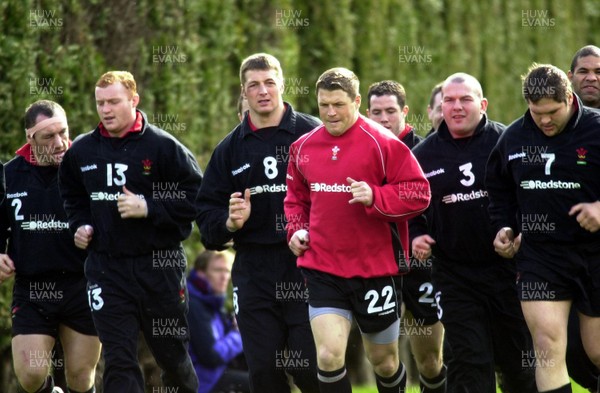 13-03-01. Swansea's Scott Gibbs (red) leads out the Welsh team at training.  