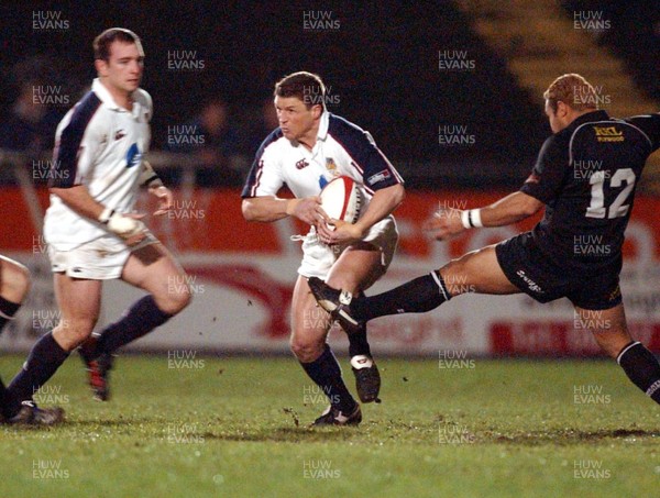 27-12-02. Swansea v Neath Neath's Dave Tiueti tries to stop Scott Gibbs. 