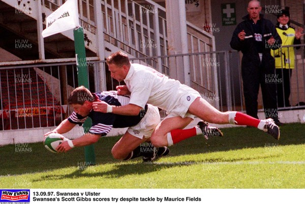 SWANSEA'S SCOTT GIBBS TOUCHES OVER FOR A TRY, FOLLOWED BY ULSTER'S MAURICE FIELD DURING THE FIRST HALF OF THE EURO HEINEKEN LEAGUE MATCH AT ST HELENS, SWANSEA. PIC:JAMES DAVIES.