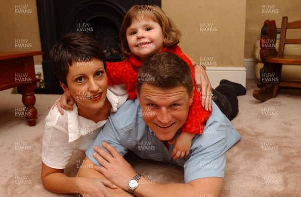 26.09.01 Welsh Edition   Welsh rugby player Scott Gibbs at home with his wife Sharyn and daughter Olivia.  