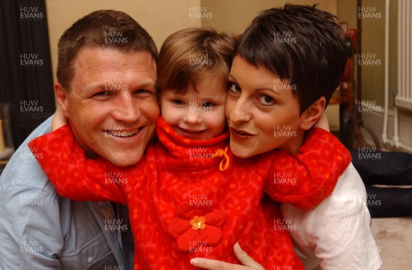 26.09.01 Welsh Edition   Welsh rugby player Scott Gibbs at home with his wife Sharyn and daughter Olivia.  