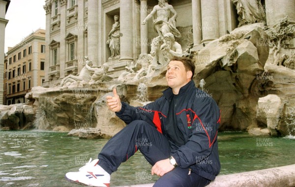 041096 -  Scott Gibbs tosses a coin for luck while visiting the Trevi Fountain in Rome