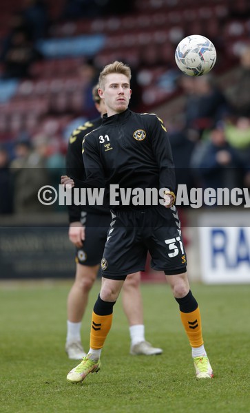 220122 - Scunthorpe United v Newport County - Sky Bet League 2 - Oli Cooper of Newport County warms up before match