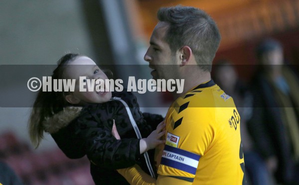 220122 - Scunthorpe United v Newport County - Sky Bet League 2 - Bella greets her daddy Matty Dolan of Newport County at the end of the match