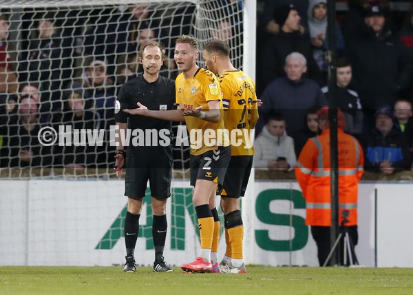 220122 - Scunthorpe United v Newport County - Sky Bet League 2 - Cameron Norman of Newport County pleads with referee Sam Purkiss against the penalty in the 2nd half