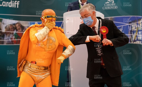 070521 - Picture shows Captain Beany and First Minister Mark Drakeford bumping elbows after winning Cardiff West during the Senedd elections in the House of Sport, Cardiff